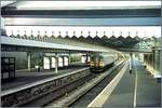 Tenby / Dinbich-y-pysgod a little station in Wales wiht a class 153 on the way to  Swansae / Abertawe.

Analo picture / Nov. 2000