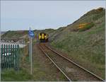 A Northern Class 156 is arring at the smals Nethertwn Station.