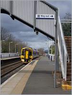 The ScotRail Class 158 (158 735) is arriving at Dalmeny.