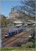 The Scotrail 170 471 (Class 170) is arriving at Edinburgh Waverley.