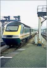 A  first  Class 43 HST 125 service is leaving Swansea / Abertawe.