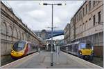 The Scotrail 334 016 and a Virgin  Pendolino  in Edinburgh Station.