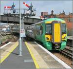 The 377 112 is leaving Hastings.