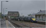 A Ssoutheastern High Speed Service to London St Pancras is arriving by a heavy rain and wind in Canaterbury West.