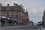 A Edinburgh tram is approching the St Andrew Square Station.