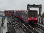 DLR (Docklands Light Railway) train is arriving West India Quay.