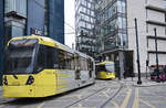 Manchester Metro Link Trams 3072 and 3111 (Bombardier M5000) crossing Aytoun Street in the city centre of Manchester. Date: March 11, 2018.