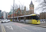 Manchester Metrolink Tram 3035 (Bombardier M 5000) passing the Minshull Street Crown Court in Aytoun Street.