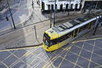 Tram 3085 (Bombardier M5000) from Manchester Metrolink crossing London Road in Manchester - view from Manchester Piccadilly Station.