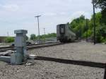 Tail end of Amtrak as it rounds the last curve and onto the bridge across the Mississippi River.