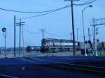 SD70MAC with Burlington Northern paint are about to roll thru the Main Street crossing in Burlington, Iowa on 9 Apr 2005.