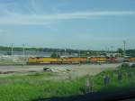 BNSF 8825, 8253, 5457, Santa Fe 4710 & BNSF 5635 lead a mixed freight into the Burlington, Iowa yard on 26 July 2003.