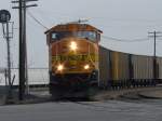 Westbound BNSF 9906 pulls its empty coal train thru the Burlington, Iowa yard and is about to enter the Main Street crossing on 27 Feb 2006. The engineer and conductor are seen in this photo.