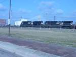 Norfolk Southern is a rare site in Burlington, Iowa. Here NS 2683 & 9805 pull an empty CEFX coal train thru the yard and approach the Main Street crossing. The auto bridge over the Mississippi River is visible behind the loks. 6 Mar 2006