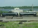 A pair of brand new tank cars roll thru the yard at Burlington, Iowa on 26 July 2003.