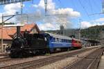 Former Jura-Simplon Bahn JS-35 hauls a colourful extra train out of Burgdorf on 17 May 2025.