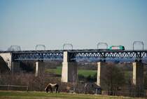 SNCB Electric engine type 28 (traxx) hauling a freight train towards Germany over the Moresnet bridge (height : 58 m, length: 1120 m, built between 1915 and 1917, destroyed on 10th May 1940, rebuilt in the same year, destroyed again on 10th September 1944, rebuilt in 1944-1948, renovated from 2002 to 2004). Picture of March 2009.