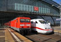 On the left site 114 021 with a local train from Berlin Charlottenburg to Frankfurt(Oder) and on the left site 401 510-3  Gelsenkirchen  as ICE599 from Berlin Ostbahnhof to Munich main station. Berlin main station, 25.2.2012.