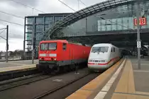 On the left site 114 027-6 with a local train from Berlin Charlottenburg to Frankfurt(Oder) and on the right site 401 056-7  Heppenheim/Bergstra�e  as ICE691 from Berlin Ostbahnhof to Stuttgart main station. Berlin main station, 25.2.2012.