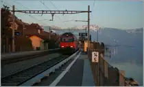 Re 460 117-5 wiht an IR on the way to Lausanne in St Saphorin.
01.03.2012