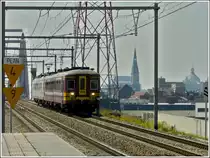 A local train is arriving at the station Antwerpen-Luchtbal on June 23rd, 2010.
