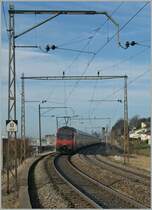 Re 460 052-4 pushes the  Jumbo  IC 710 to Genve-Aroport. 
Pictured by Neyruz, 12.03.2012