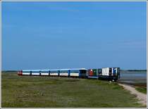 A train of the Wangerooger Inselbahn taken on its way from the harbour to the village of Wangerooge on May 7th, 2012.