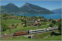 BLS Re 4/4 wiht a  Goldenpass IR  on the way to Zweisimmen by Faulensee. 
27.08.2012