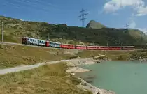 A Bernina Train to St- Moritz by the Lago Bianco between Alp Gr�m and Bernina Ospizio . 
10.09..2012 