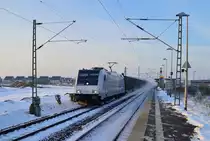 The NOVELIS alloytrain to Nievenheim rides through the station Allerheiligen with the electricale locomotive 185 696-2 from RAILPOOL and an big snowdustcloud around. Yeasterday it had snowed alot and so this photo could happen. Saturday 8th of december 2012