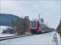 The IR 3739 Troisvierges - Luxembourg City is running with red lights between Cinqfontaines and Maulusm�hle on February 13th, 2013.
