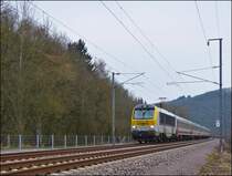 3011 is hauling the IR 117 Liers - Luxembourg City through the S�re valley in Erpeldange/Ettelbr�ck on February 26th, 2013.