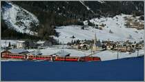 The RhB Ge 4/4 III with his RE St Moritz - Chur is approaching Bergn/Bravuogn. 
16.03.2013