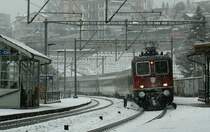 SBB Re 4/4 II with an Interregio by a strong winter weather on the way to Brig. 
17.12.2008