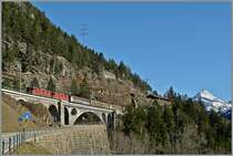 Two Re 4/4 wiht a Carco train near Wassen of the middle Meinereuss-Bridge. 
14.03.2014