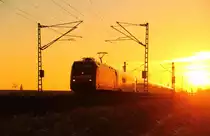 101 126-1 with ICE 1008 near Reundorf moving through the sunset 
05/01/2015.