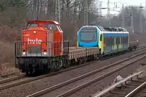 203 141-7 ( V 160.9 ) ( 92 80 1203 141-7 D-HVLE ) passing Bergfelde station in front of an unfinished Stadler Rail FLIRT multi-unit rail coach. The c/s of the FLIRT looks like it is designated to become a new member of the Westfalenbahn train fleet. V 160.9 was built in 1975 by VEB Lokomotivbau Elektrotechnische Werke -Hans Beimler-, Hennigsdorf (LEW), construction number 15076, acceptance date: 1975-06-26. It first was named 110 804-2 ( DR ), then 112 804-0 ( DR ), 202 804-1 ( DR + DB )
