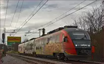 Multiple units 312-107 run through Maribor-Tabor on the way to Maribor station. /15.12.2014