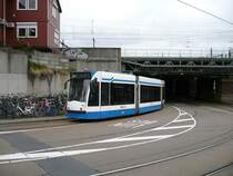 GVBA tram 2135 coming from the  De Ruyterkade . Stationsplein, Amsterdam 22-04-2015.