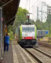 . BLS Re 486 501 is hauling a freight train through the station of Bonn-Beuel on June 27th, 2015.