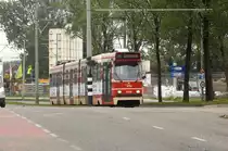 HTM 3049 in Delft. Line 1. The street is going uphill. That's why the tram isn't running equal on the photo.

Date: 9. October 2011.