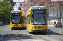DVB 2837 and DVB 2834 crossing in the street Ostraallee in Dresden. Both trams are running on line 11 and was build by Bombardier in 2009 (NGTD12DD).

Date: 7. June 2014.