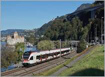 The SBB RABe 523 030 by th Castle of Chillon on the way to Allaman.

11.10.2019