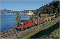 The SBB Re 420 298-2 with a Cargo train by the Castle of Chillon.

11.10.2019