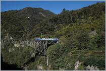 The SSIF ABe 8/8 N° 22  Ticino  on the way from Locarno to Domodossola on the Isorno Bridge by Intragna. 10.10.2019