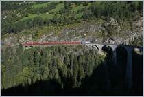 A RhB Ge 4/4 III 649  20 Minuten  with his Albula Fast-Serice from Chur to St Moritz by Filisur.

12.09.2016