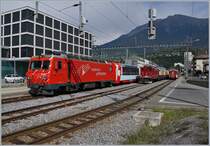 The Glacier Express is leaving Brig; in the background the old FO HGe 4/4 36. 

31.08.2019