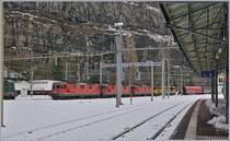 Three SBB RE4/4 II with a Cargo train are arriving at the St Maurice Station. 

11.12.2017