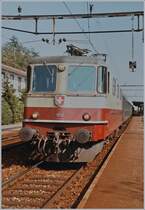 The SBB Re 4/4 II 11252 wiht the fast train service 526 by his stop in Grenchen Süd. 
08.10.1984