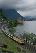 A SBB Re 460 with an IR to Brig near the Castle of Chillon. 

13.06.2018